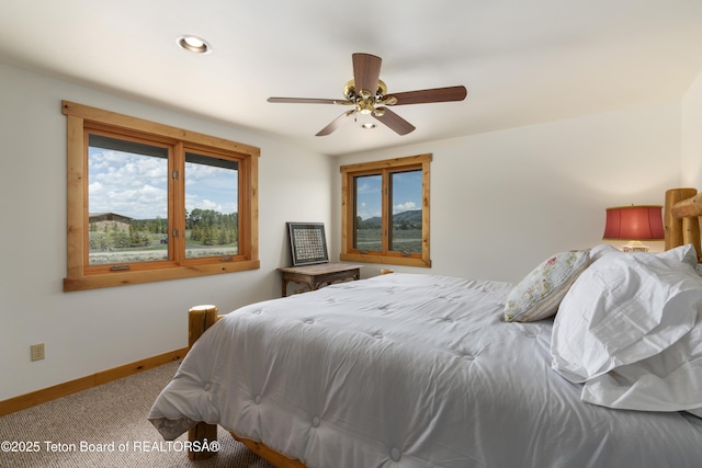 500 E Solitude Dr, Jackson, WY 83001 - bedroom with carpet floors, baseboards, and ceiling fan