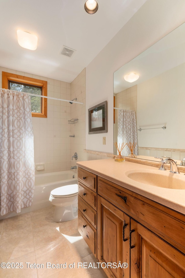 25655 Buffalo Run, Moran, WY 83013 - bathroom featuring vanity, tile patterned flooring, shower / bath combination with curtain, and toilet