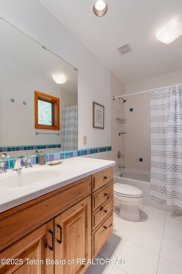 25655 Buffalo Run, Moran, WY 83013 - full bathroom with tile patterned floors, vanity, toilet, and shower / bath combo