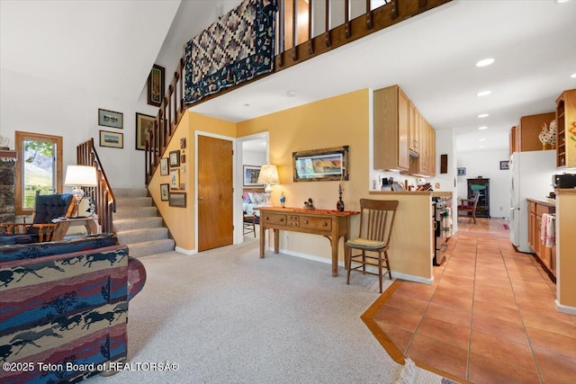 3470 S Winding Trail Dr, Jackson, WY 83001 - living room featuring a towering ceiling, stairs, recessed lighting, baseboards, and light carpet