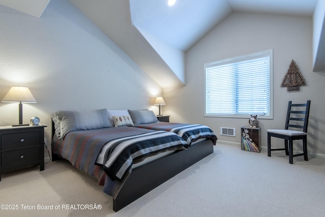 125 Cobble Creek Ln Unit 75, Driggs, ID 83422 - bedroom with lofted ceiling, light colored carpet, and baseboards