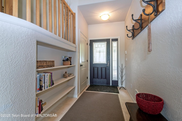 125 Cobble Creek Ln Unit 75, Driggs, ID 83422 - entrance foyer featuring a textured wall and baseboards