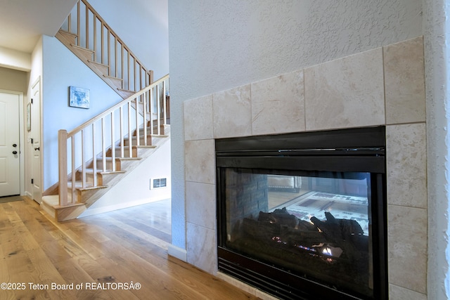 125 Cobble Creek Ln Unit 75, Driggs, ID 83422 - detailed view of a tile fireplace, wood finished floors, and baseboards