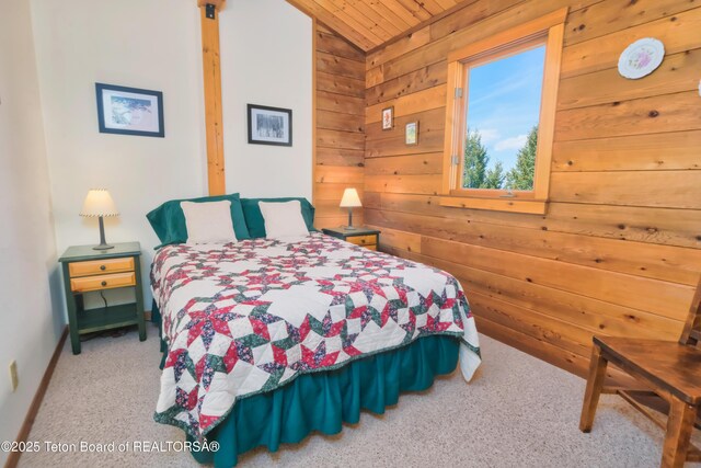3190 Sorensen Creek Dr, Victor, ID 83455 - carpeted bedroom featuring vaulted ceiling, wood walls, wooden ceiling, and baseboards