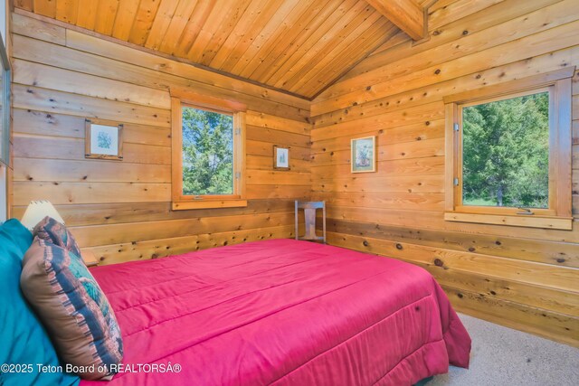 3190 Sorensen Creek Dr, Victor, ID 83455 - bedroom with multiple windows, carpet, wooden ceiling, and wooden walls