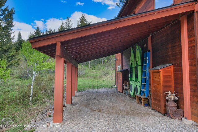 3190 Sorensen Creek Dr, Victor, ID 83455 - view of vehicle parking with an attached carport and driveway