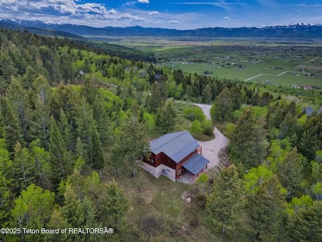 3190 Sorensen Creek Dr, Victor, ID 83455 - view of subject property with a mountain backdrop and a forest