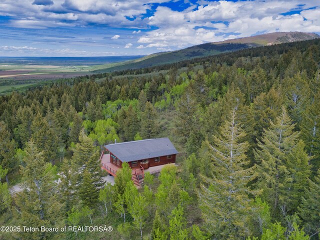 3190 Sorensen Creek Dr, Victor, ID 83455 - aerial view of property and surrounding area featuring a forest and a mountain backdrop
