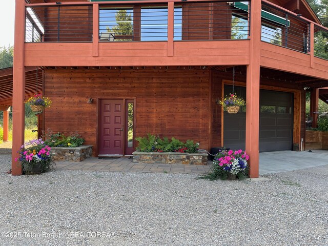 3190 Sorensen Creek Dr, Victor, ID 83455 - view of front facade with an attached garage and driveway