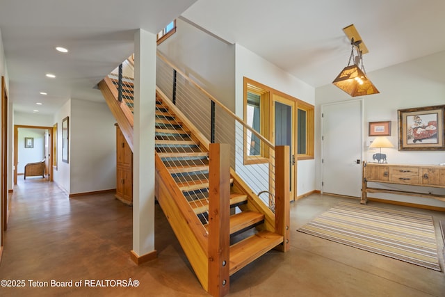 25000 N Deer Ct, Moran, WY 83013 - staircase with finished concrete floors, recessed lighting, and baseboards