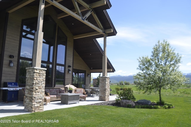 1795 Fumarole Dr, Victor, ID 83455 - view of patio / terrace with grilling area, a mountain view, and outdoor lounge area