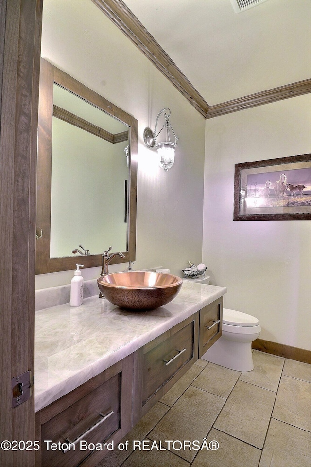 1795 Fumarole Dr, Victor, ID 83455 - bathroom with crown molding, vanity, and tile patterned floors
