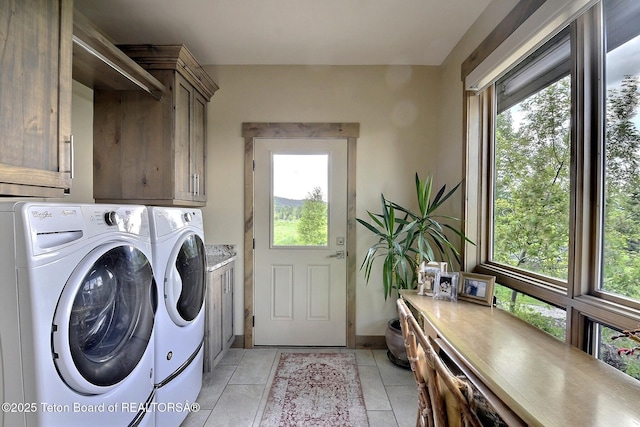 1795 Fumarole Dr, Victor, ID 83455 - laundry room with washer and clothes dryer, cabinet space, and healthy amount of natural light
