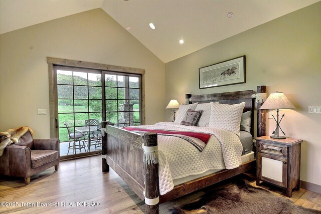 1795 Fumarole Dr, Victor, ID 83455 - bedroom with access to exterior, wood finished floors, high vaulted ceiling, and recessed lighting