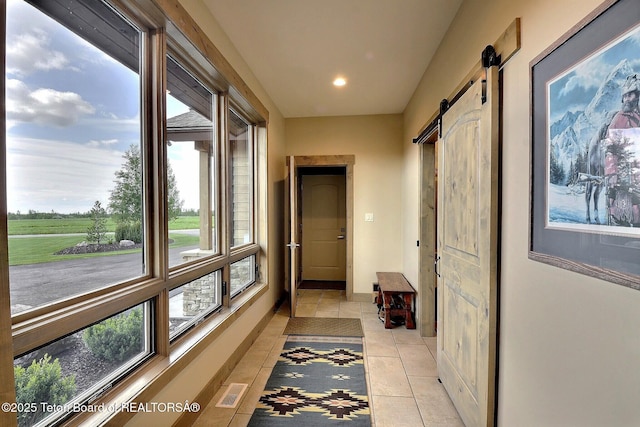 1795 Fumarole Dr, Victor, ID 83455 - hall featuring a barn door, light tile patterned floors, and recessed lighting