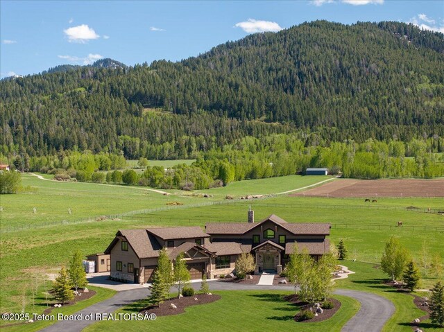 1795 Fumarole Dr, Victor, ID 83455 - overview of rural landscape with a forest and a mountain backdrop