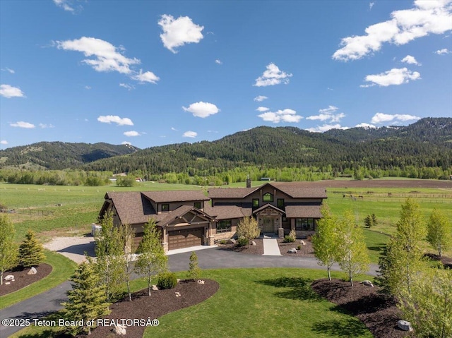 1795 Fumarole Dr, Victor, ID 83455 - view of mountain background with a heavily wooded area and rural landscape