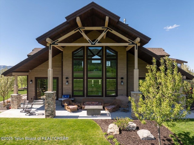 1795 Fumarole Dr, Victor, ID 83455 - rear view of property featuring a patio, outdoor lounge area, and a yard