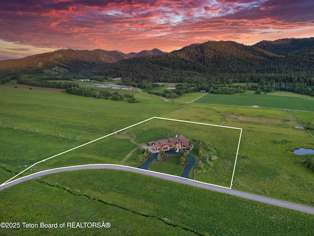 1795 Fumarole Dr, Victor, ID 83455 - aerial view at dusk of a mountain view, property parcel outlined, and a view of rural / pastoral area