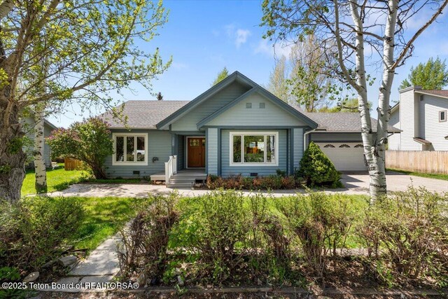 3008 Alpine View Ln, Jackson, WY 83001 - single story home with a shingled roof, driveway, and a garage