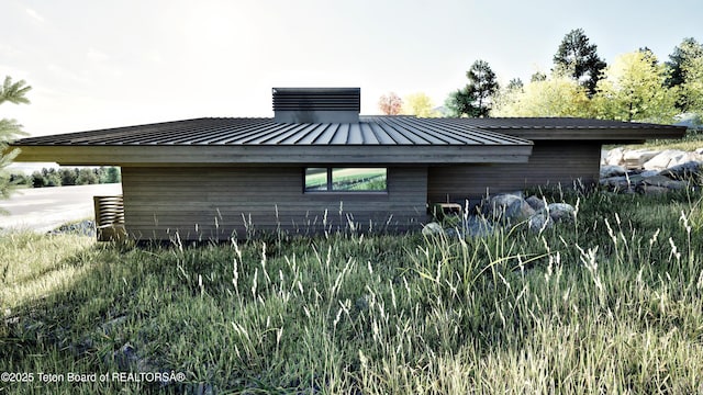 646 Lariat Loop, Jackson, WY 83001 - view of side of home with a metal roof