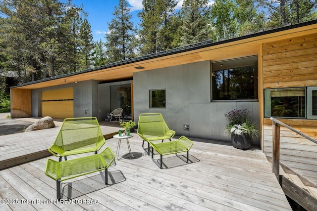 2825 S Sparrow Hawk Rd, Wilson, WY 83014 - wooden terrace featuring a garage