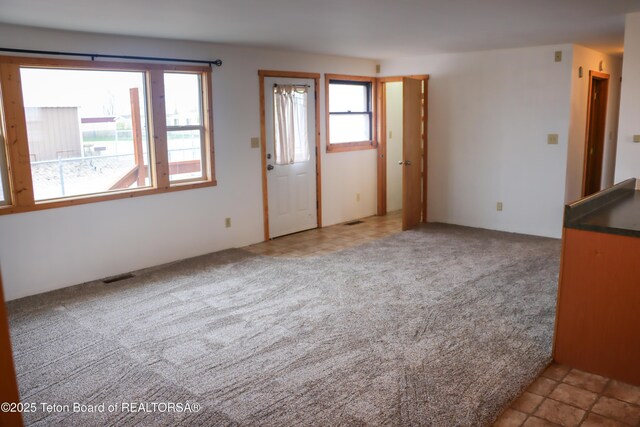 510 Rakestraw Ave, Marbleton, WY 83113 - unfurnished living room featuring carpet