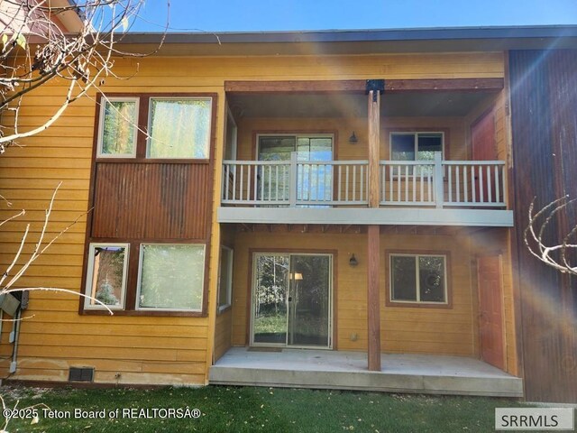 7580 Mountain Laurel Dr Unit A-3, Victor, ID 83455 - rear view of house with a balcony