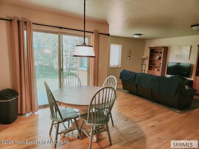 7580 Mountain Laurel Dr Unit A-3, Victor, ID 83455 - dining room featuring light wood-style flooring