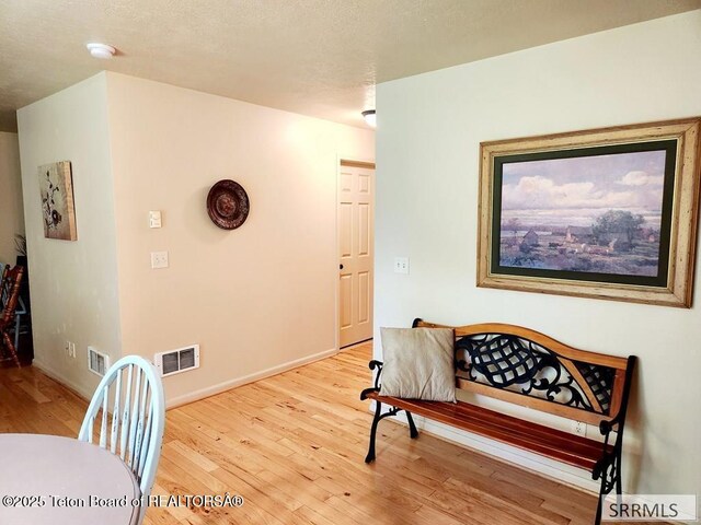 7580 Mountain Laurel Dr Unit A-3, Victor, ID 83455 - sitting room with wood finished floors and baseboards