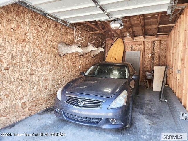 7580 Mountain Laurel Dr Unit A-3, Victor, ID 83455 - garage featuring a garage door opener