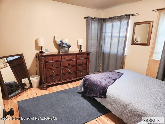 7580 Mountain Laurel Dr Unit A-3, Victor, ID 83455 - bedroom featuring wood finished floors