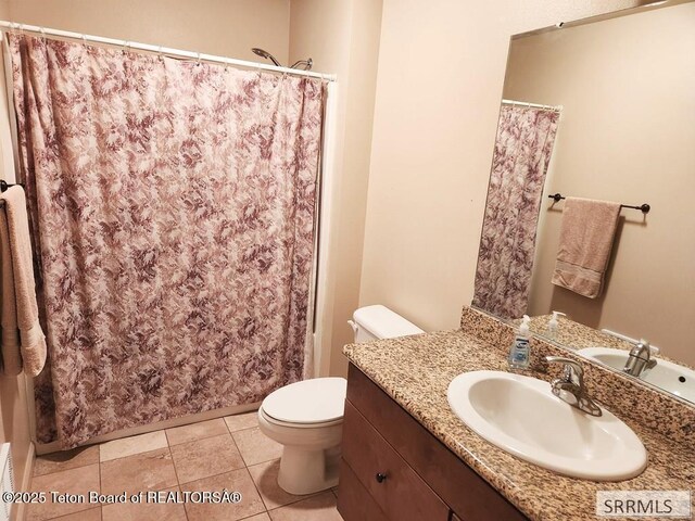 7580 Mountain Laurel Dr Unit A-3, Victor, ID 83455 - bathroom featuring vanity, toilet, a shower with curtain, and tile patterned flooring