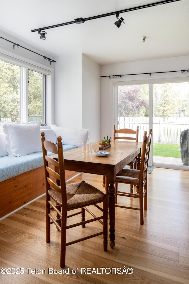 3946 Lake Creek Dr Unit 1-1-1, Wilson, WY 83014 - dining room featuring rail lighting and light wood finished floors