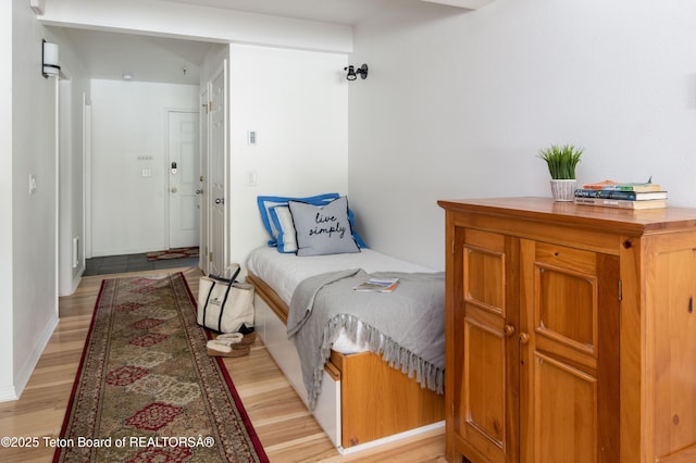 3946 Lake Creek Dr Unit 1-1-1, Wilson, WY 83014 - bedroom with light wood finished floors