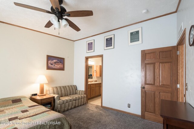 58 Blackhawk Trl, Boulder, WY 82923 - bedroom featuring light carpet, crown molding, connected bathroom, baseboards, and a ceiling fan