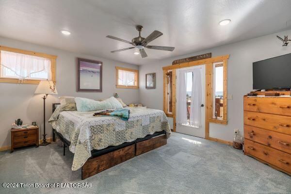 1516 Fischer Ln, Tetonia, ID 83452 - bedroom with carpet floors, baseboards, recessed lighting, a ceiling fan, and access to exterior