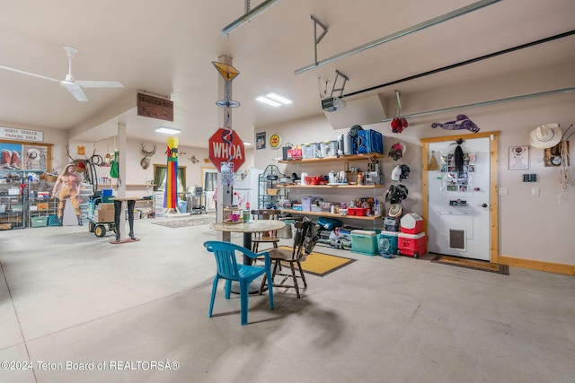 1516 Fischer Ln, Tetonia, ID 83452 - garage with a workshop area, a ceiling fan, and a garage door opener