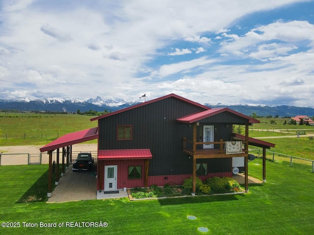 1516 Fischer Ln, Tetonia, ID 83452 - rear view of property with a mountain view, metal roof, a view of countryside, a carport, and a standing seam roof
