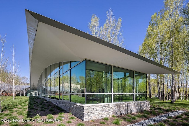 1120 S Thunder Rd, Wilson, WY 83014 - view of side of property with a sunroom