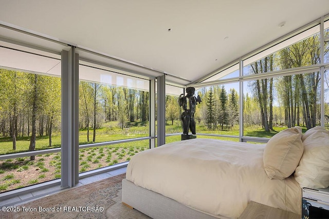1120 S Thunder Rd, Wilson, WY 83014 - bedroom with a wall of windows and vaulted ceiling