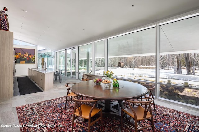 1120 S Thunder Rd, Wilson, WY 83014 - sunroom / solarium with a wall of windows, vaulted ceiling, and a sink