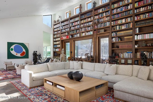 1120 S Thunder Rd, Wilson, WY 83014 - living area with a towering ceiling and built in shelves
