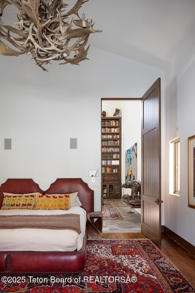 1120 S Thunder Rd, Wilson, WY 83014 - bedroom with wood finished floors and lofted ceiling