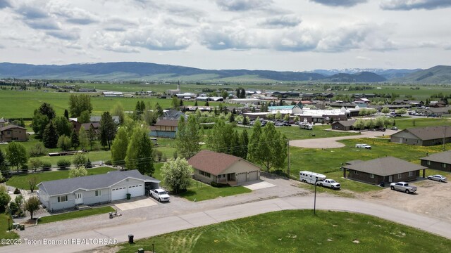 210 E 8th Ave, Afton, WY 83110 - aerial perspective of suburban area featuring a mountainous background