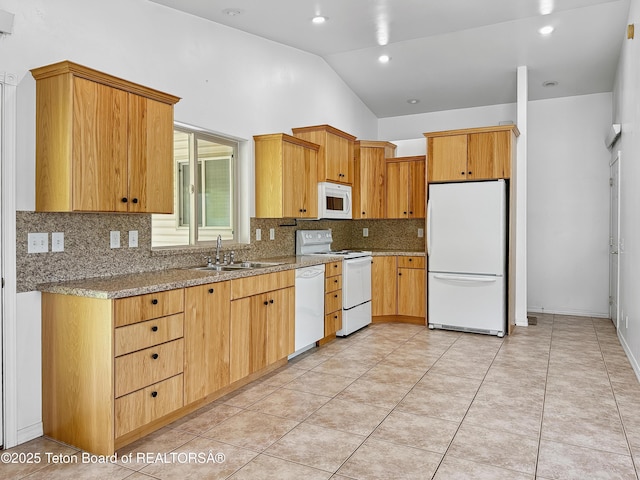 210 E 8th Ave, Afton, WY 83110 - kitchen featuring white appliances, tasteful backsplash, a sink, vaulted ceiling, and light stone counters