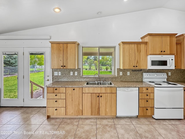 210 E 8th Ave, Afton, WY 83110 - kitchen with white appliances, a sink, tasteful backsplash, healthy amount of natural light, and high vaulted ceiling