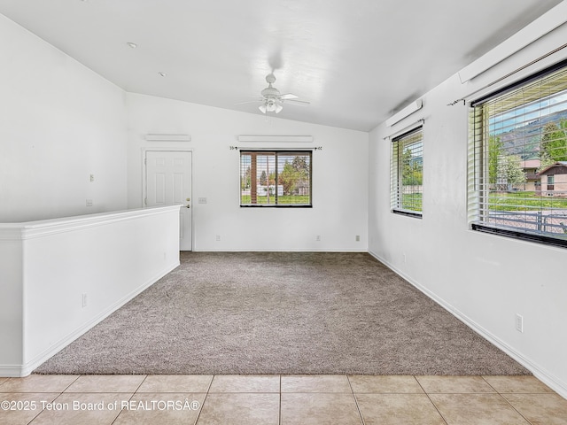 210 E 8th Ave, Afton, WY 83110 - carpeted empty room featuring vaulted ceiling, ceiling fan, baseboards, and tile patterned flooring