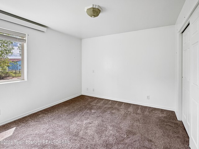 210 E 8th Ave, Afton, WY 83110 - unfurnished bedroom with carpet, a closet, and baseboards