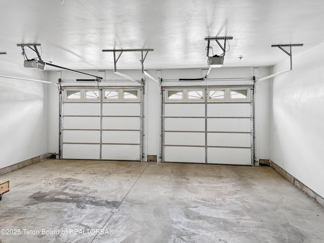 210 E 8th Ave, Afton, WY 83110 - garage with a garage door opener and baseboards